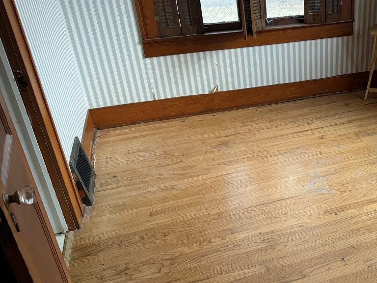 Hardwood-floor room cleared after an eviction cleanout